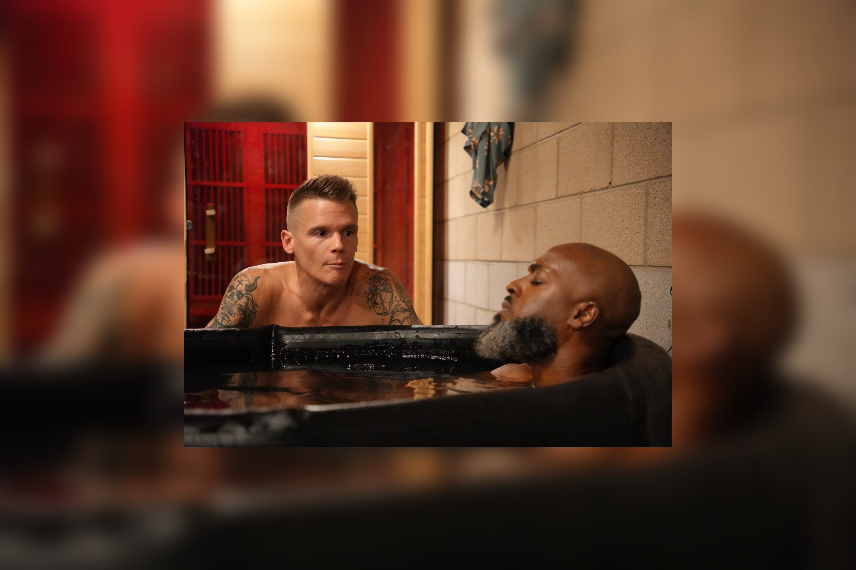 Members of The Male Compass in a cold plunge and sauna session
